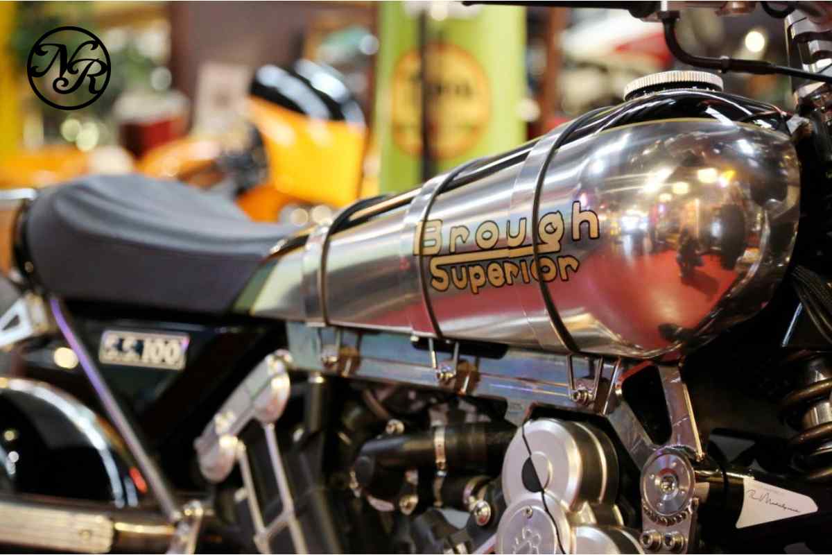 A used motorcycle being inspected at Naked Racer Moto Co., emphasizing expert advice for buyers.